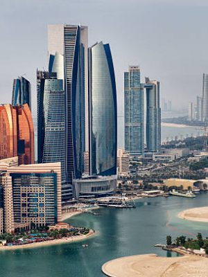 Helicopter point of view of Abu Dhabi skyline with surrounding area.